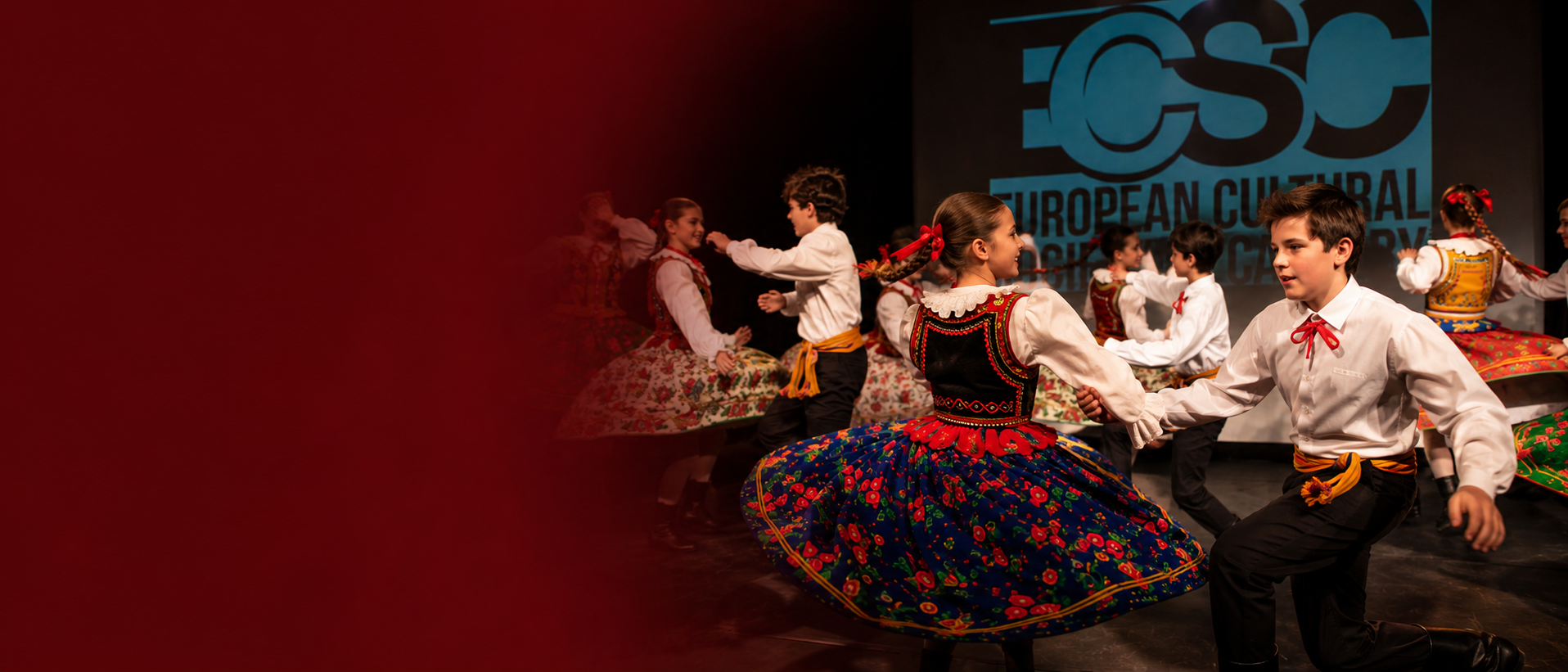 European folk dancers performing on stage at an ECSC cultural event