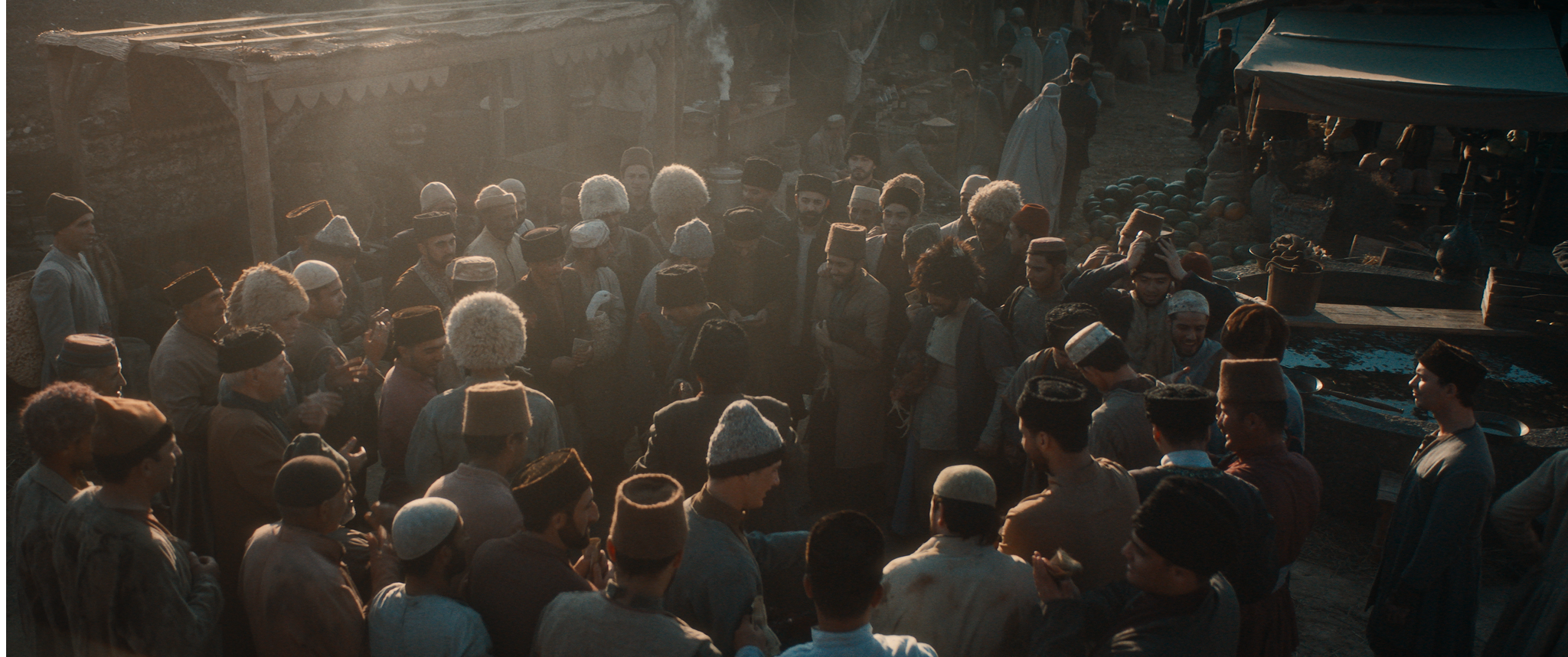 A crowd gathered in a period scene from Taghiyev: Oil