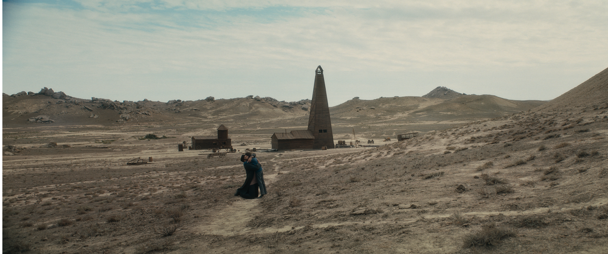 An oil derrick rising over the Absheron landscape in Taghiyev: Oil