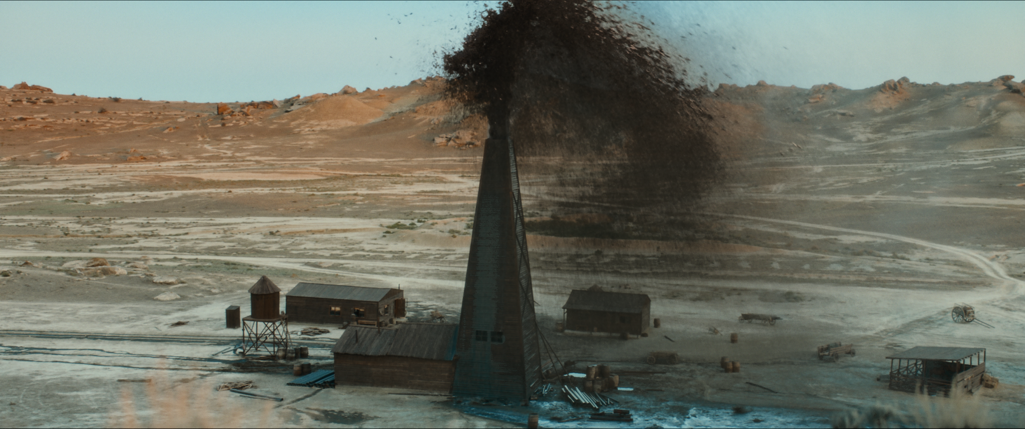 Oil erupting from a derrick in Taghiyev: Oil