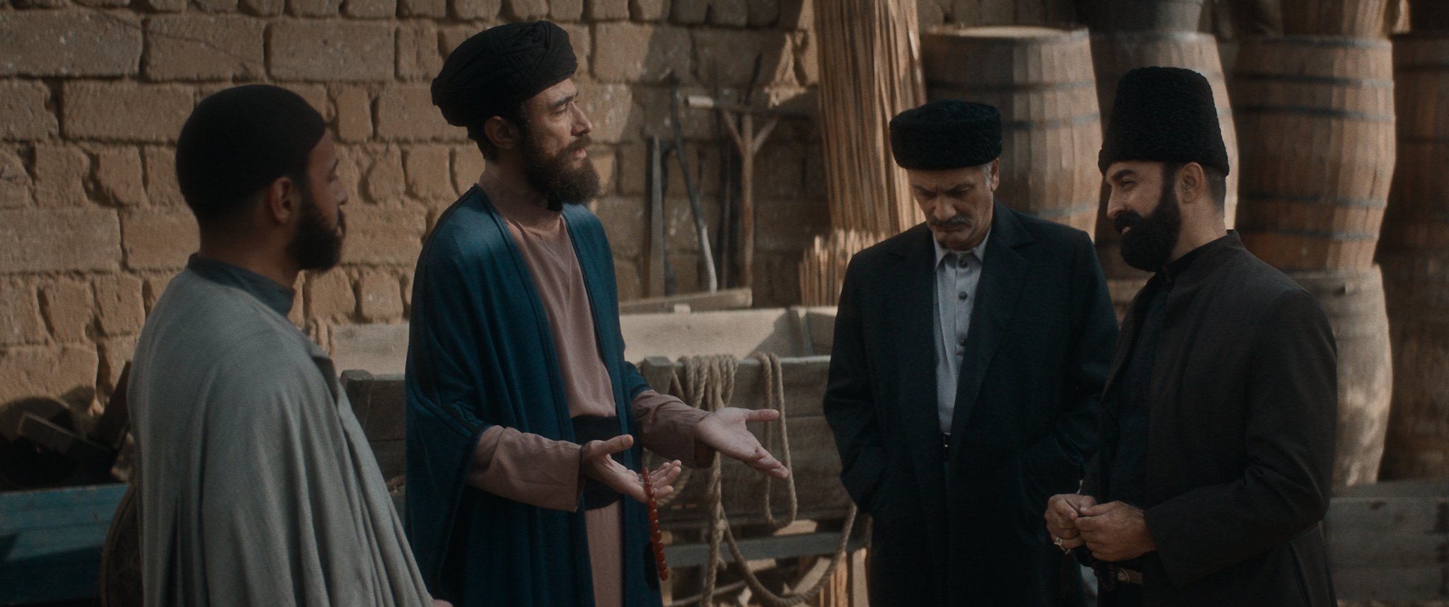 Men in period dress in a workplace scene from Taghiyev: Oil