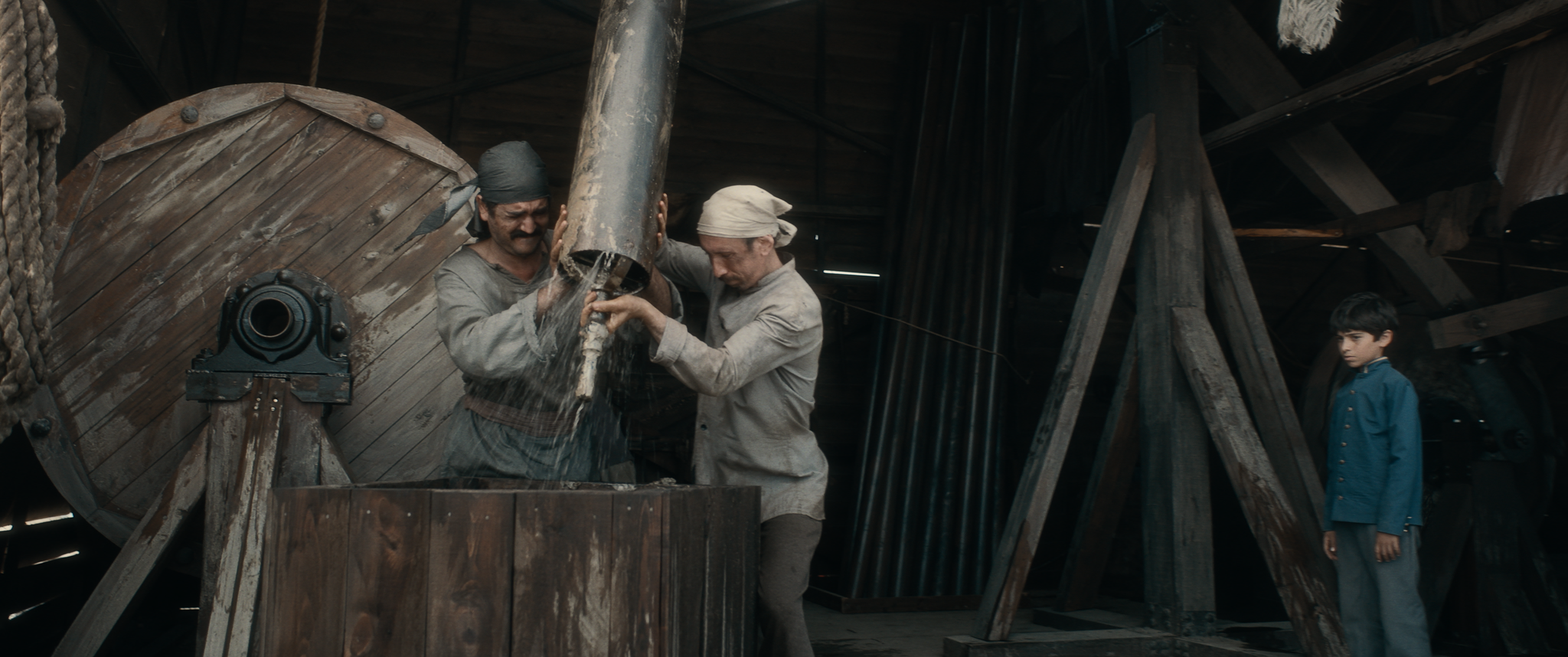 Workers drilling in a scene from Taghiyev: Oil