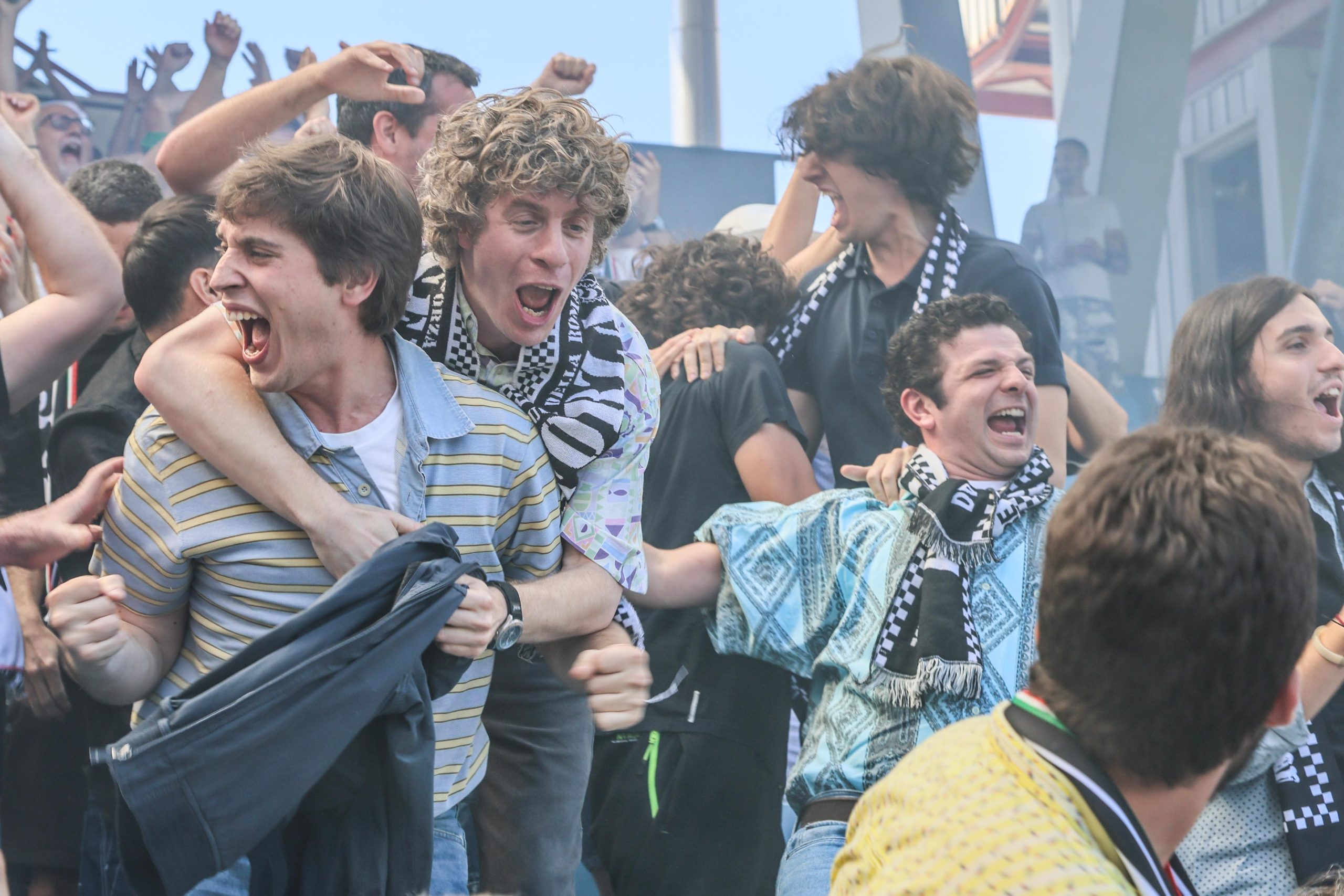 Young people celebrating together in an outdoor scene