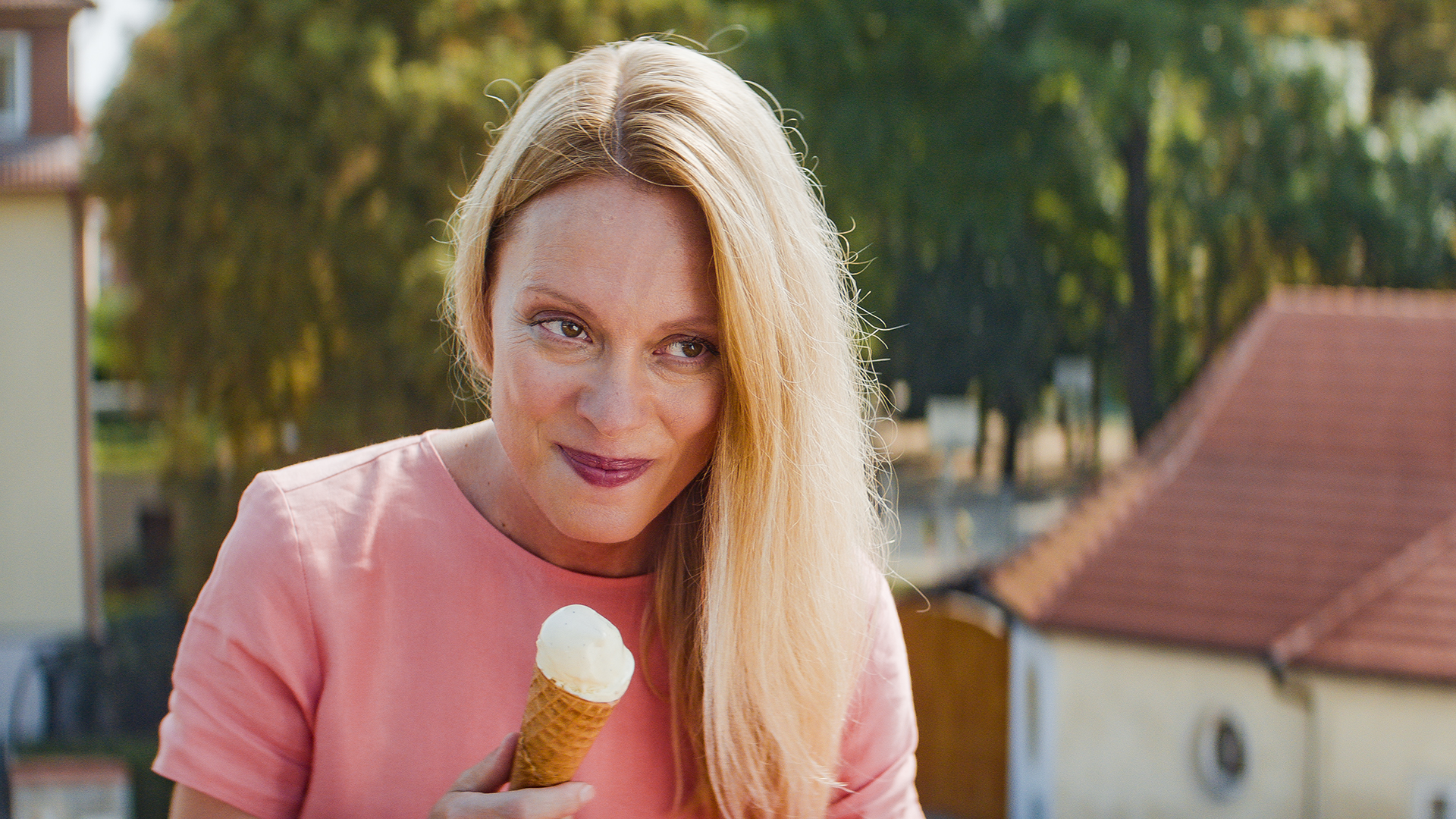 Anežka enjoying an ice cream outdoors